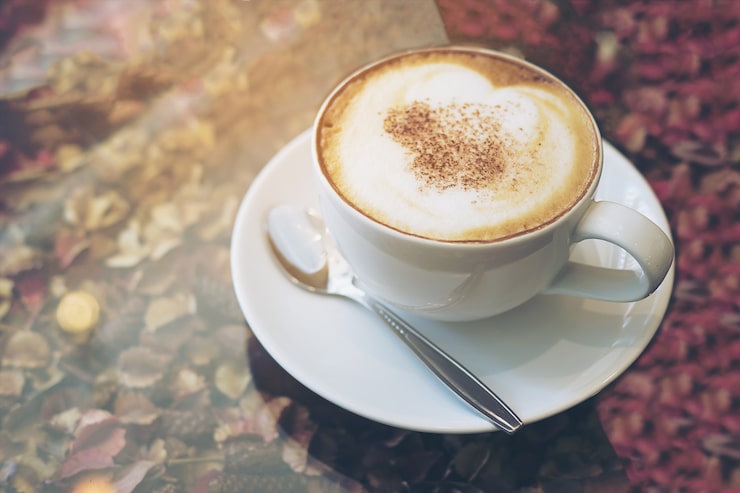 vintage-picture-hot-coffee-cup-dry-flower-petals-texture-glass-table-top_1150-6538